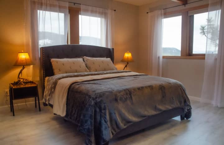 Main floor bedroom. 
Queen sized bed, with a view.