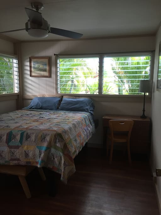 Your private bedroom with desk, dresser, closet, air conditioner and queen bed.