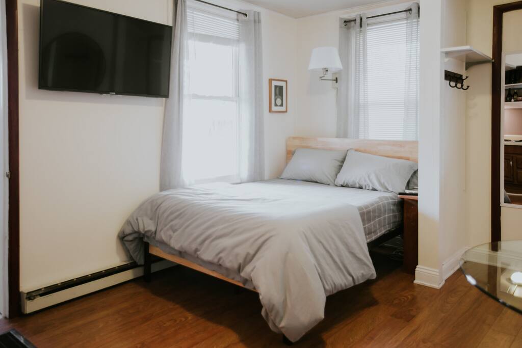 Bed, and a wall mounted 4k TV that can swivel for the ideal viewing angle.
