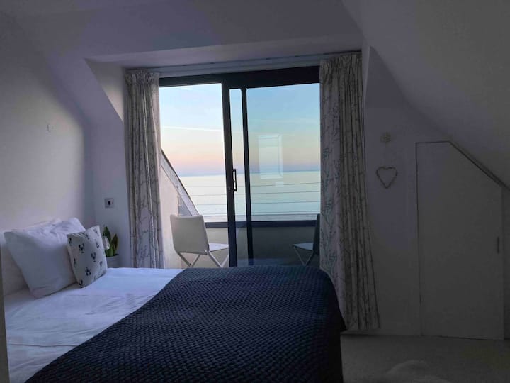 Enjoy the evening light over the sea from the upper floor bedroom.