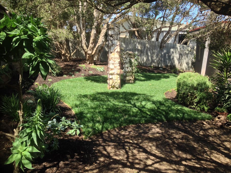 Native garden featuring 300 year old moonah trees & herb garden