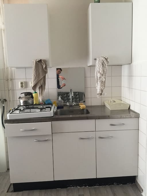 Kitchen. Big dutch sink with a small mirror.
Left up dishes and glasses, cups
Right up food
Left drawer, work material
Right drawer forks spoons ...
Right down cleaning materials, as in the middle(don’t open the middle!)
Left down pots ‘n pans