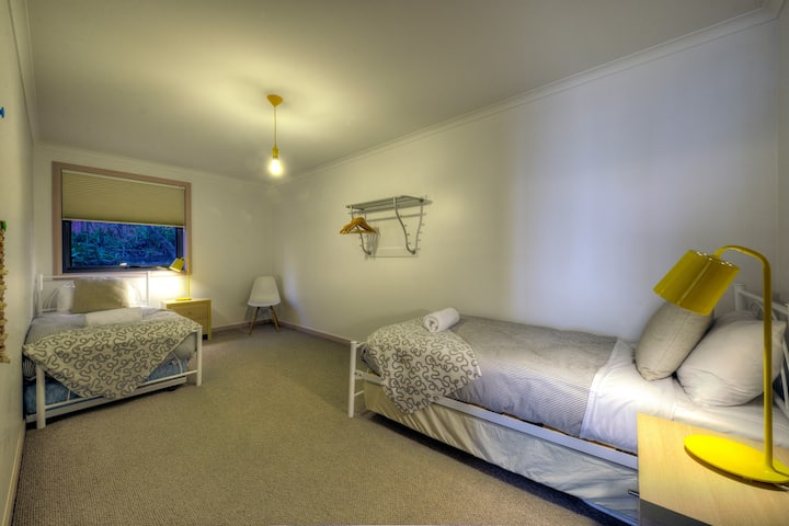 The second bedroom is very spacious with 2 single beds.