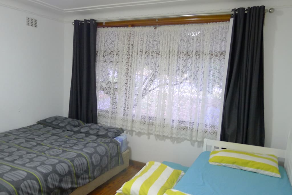 Room 1: Queen bed x 1 and single beds x 2