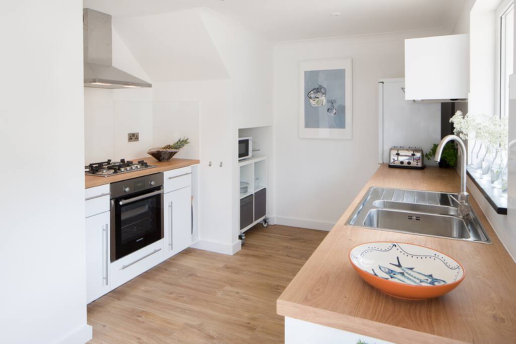 Sunny clean kitchen with all new appliances.