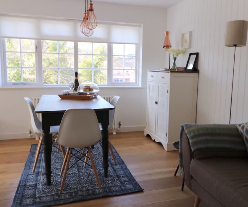 Open plan living, dining area overlooking the stream and the village centre