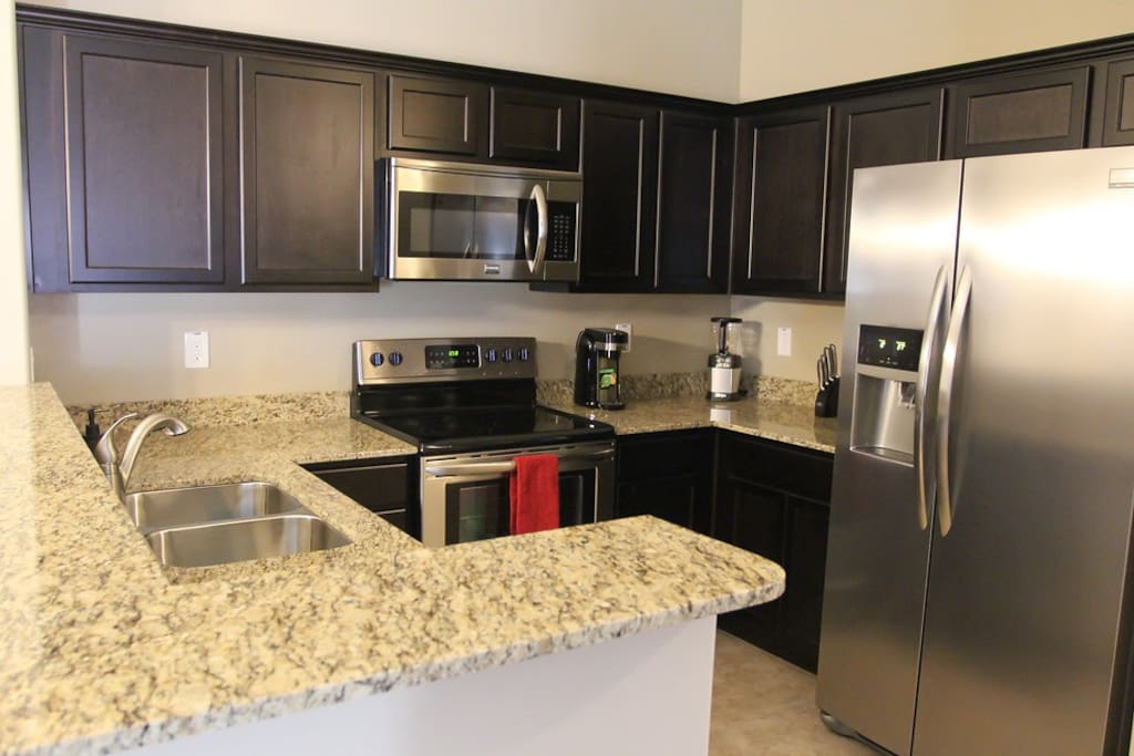 Upgraded kitchen with granite counters.