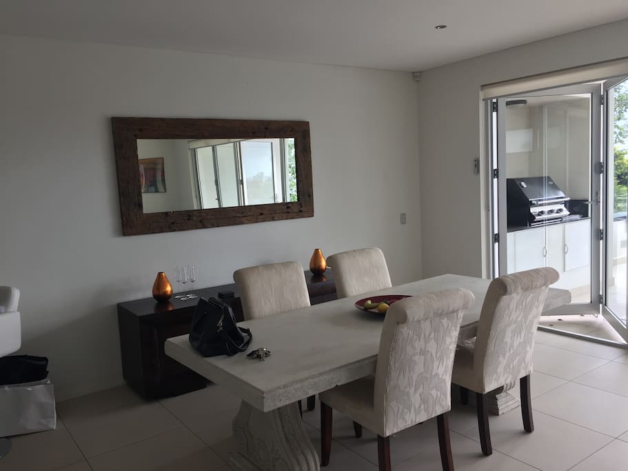 Lounge dining area opens onto entertainment deck