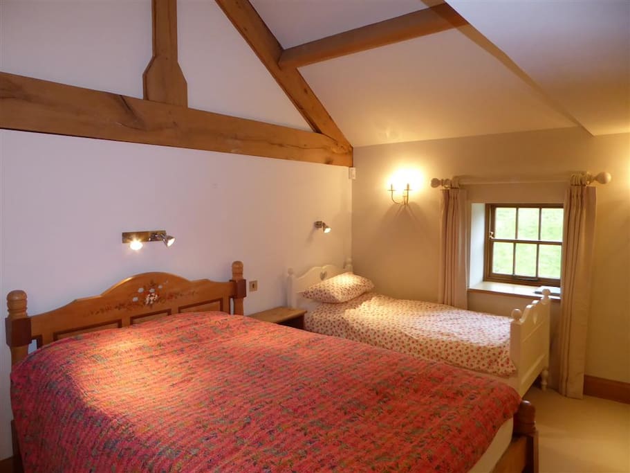 The room has an extra-long (7ft) king sized bed and a single bed
