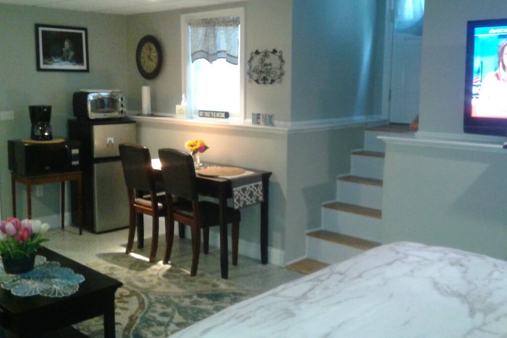 Small refrigerator, microwave and small convection oven. Private entrance to the rear of the building