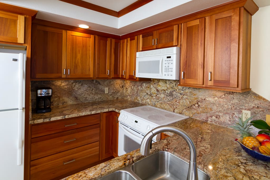Kitchen is fully supplied with large and small appliances. Full granite counters and back splash.