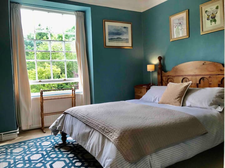 King size bedroom with garden views and en-suite shower. 

Room 2