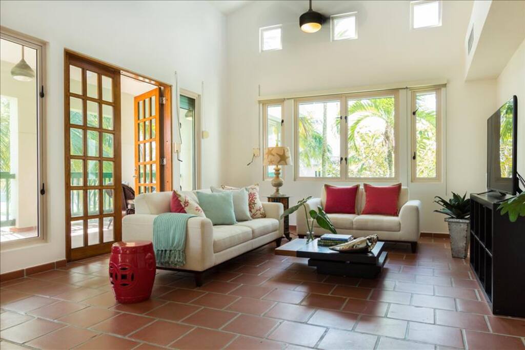 The living room has a 20 foot high ceiling, centra