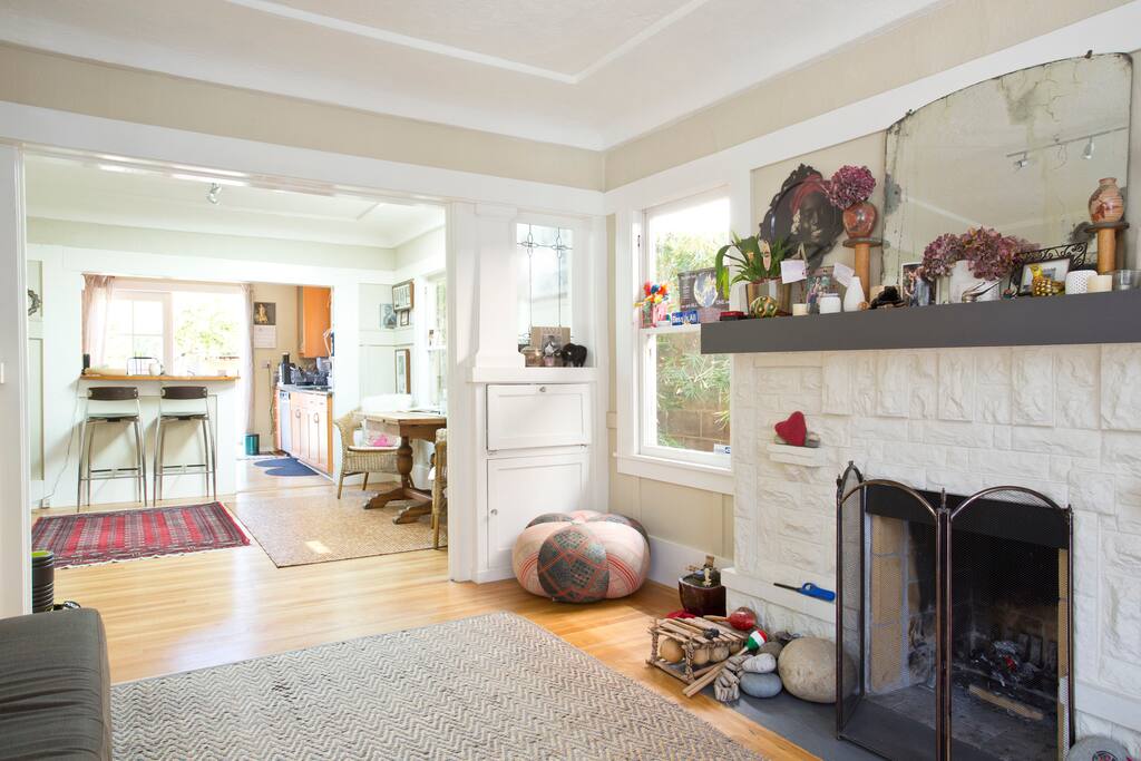 Living Room w/ fireplace view into dining and kitchen