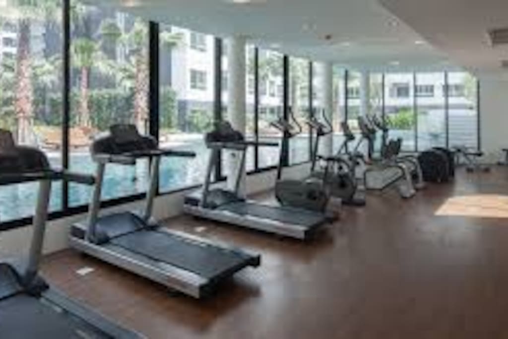 Brand new modern fitness center overlooking the swimming pools