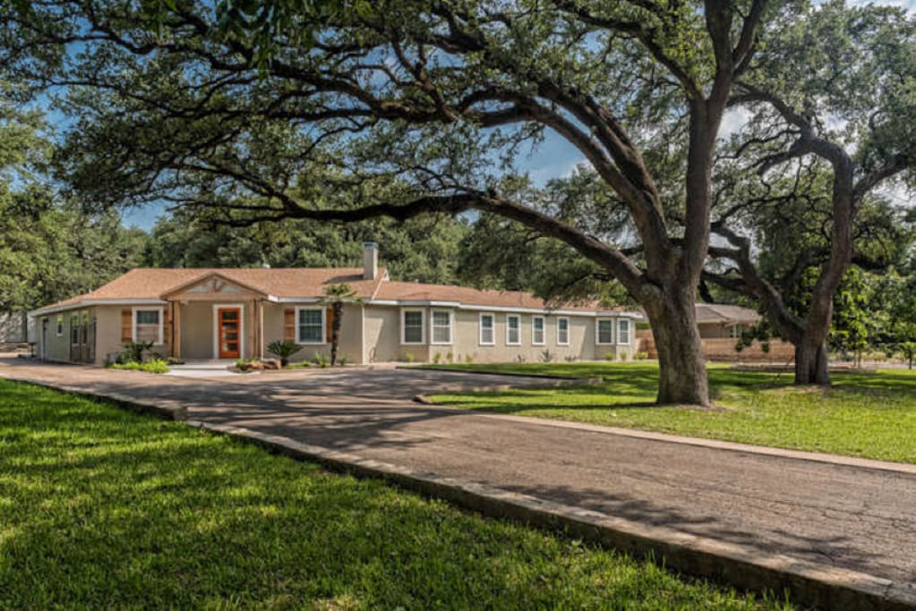 Front View - long expansive driveway can accommodate up to 8 cars