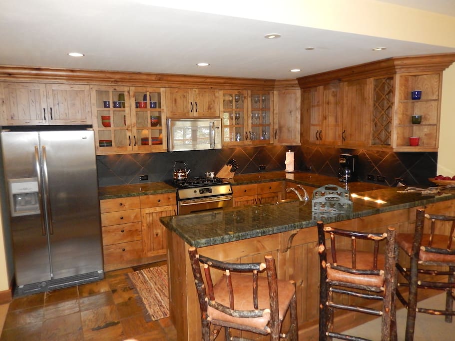 Suite comes with fully-equipped gourmet kitchen with granite countertops and stainless steel appliances.