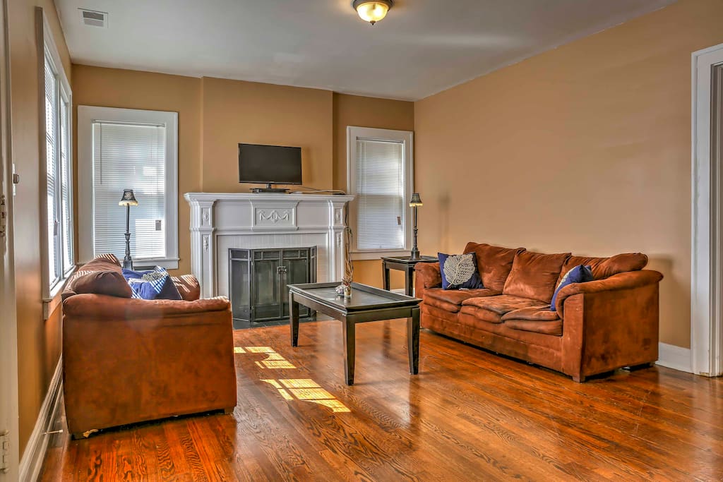 Step into the living room with plush sofas, flat-screen cable TV, and a wood-burning fireplace for those chilly nights.