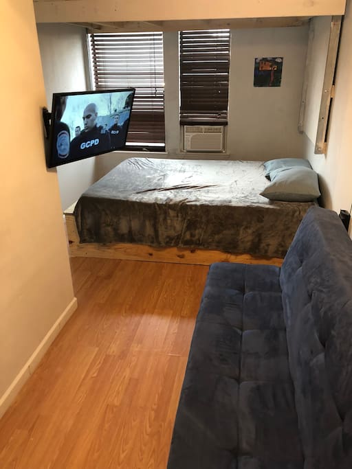 Quick view of one side of your room with your personal A/C, TV swiveled towards the futon