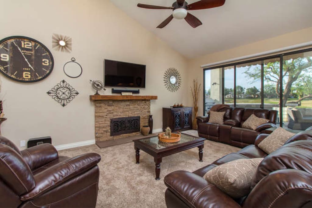 Relax in a spacious front living area...watch the golf tournament from the patio!