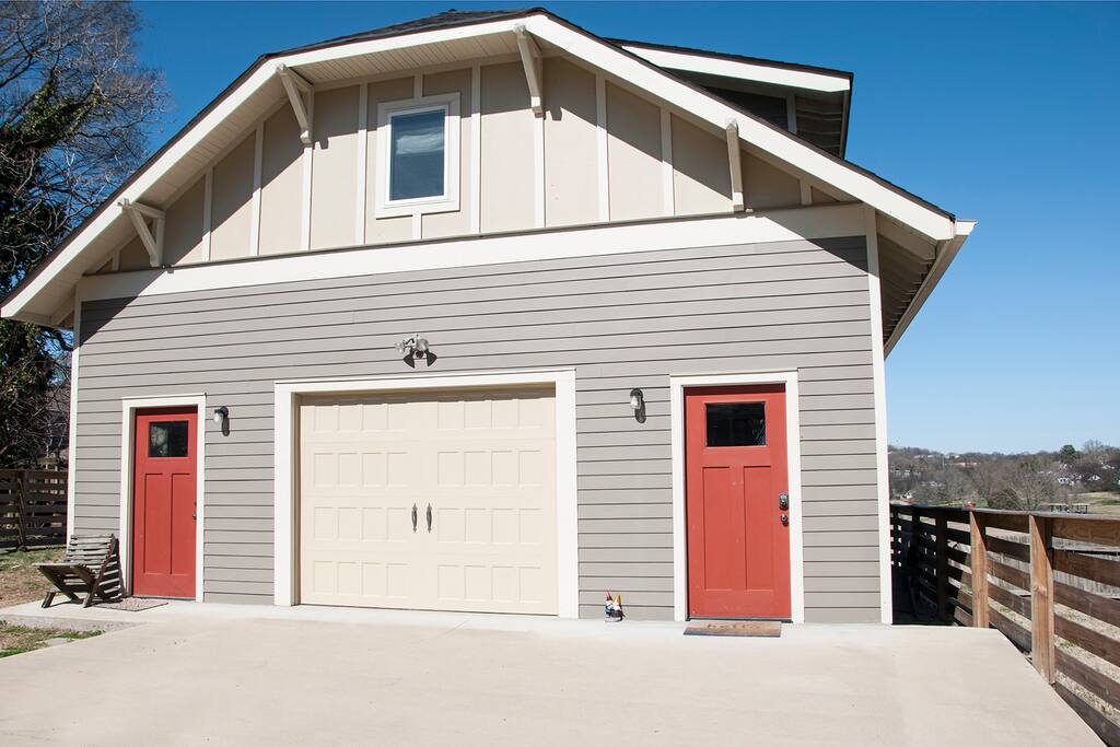 Garage view from drive. Private, key-coded door on right.