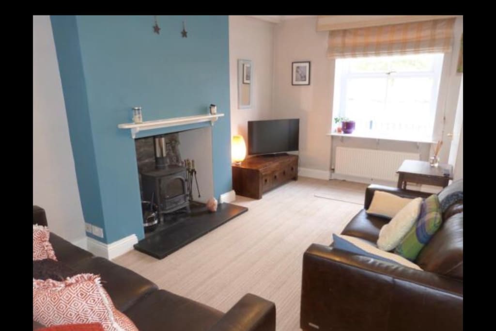 Living room with wood burner, and Netflix for those wanting to have a chilled evening.