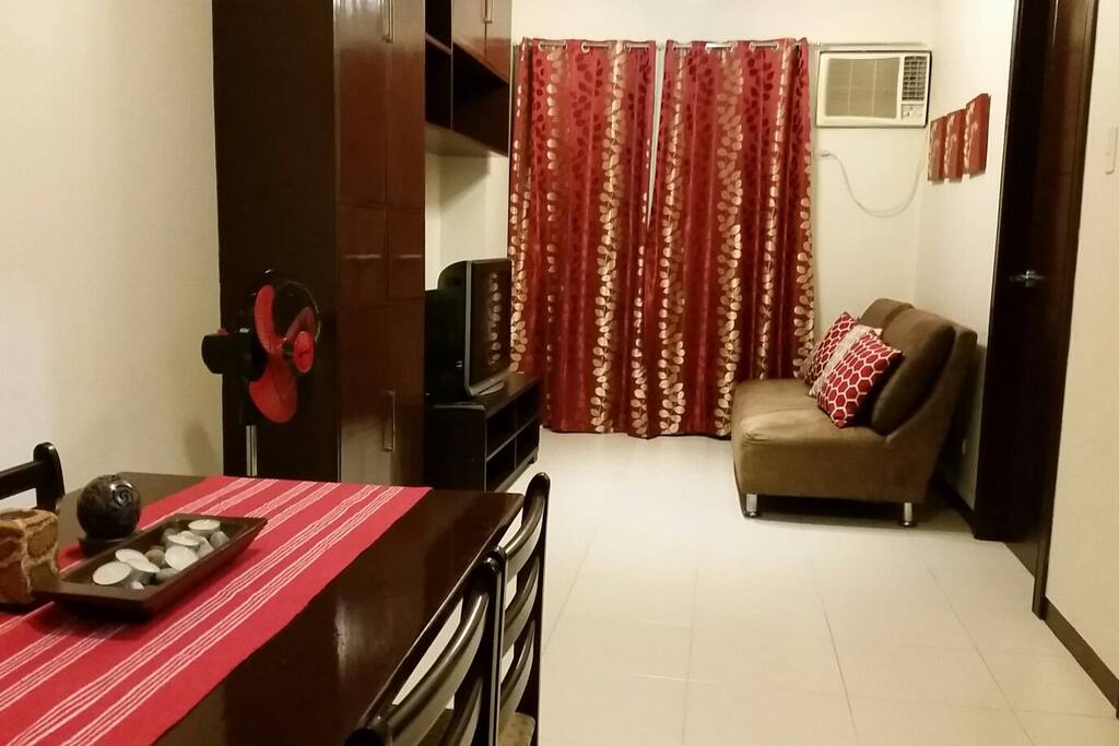 Well-lit and comfortably-spaced dining and living area