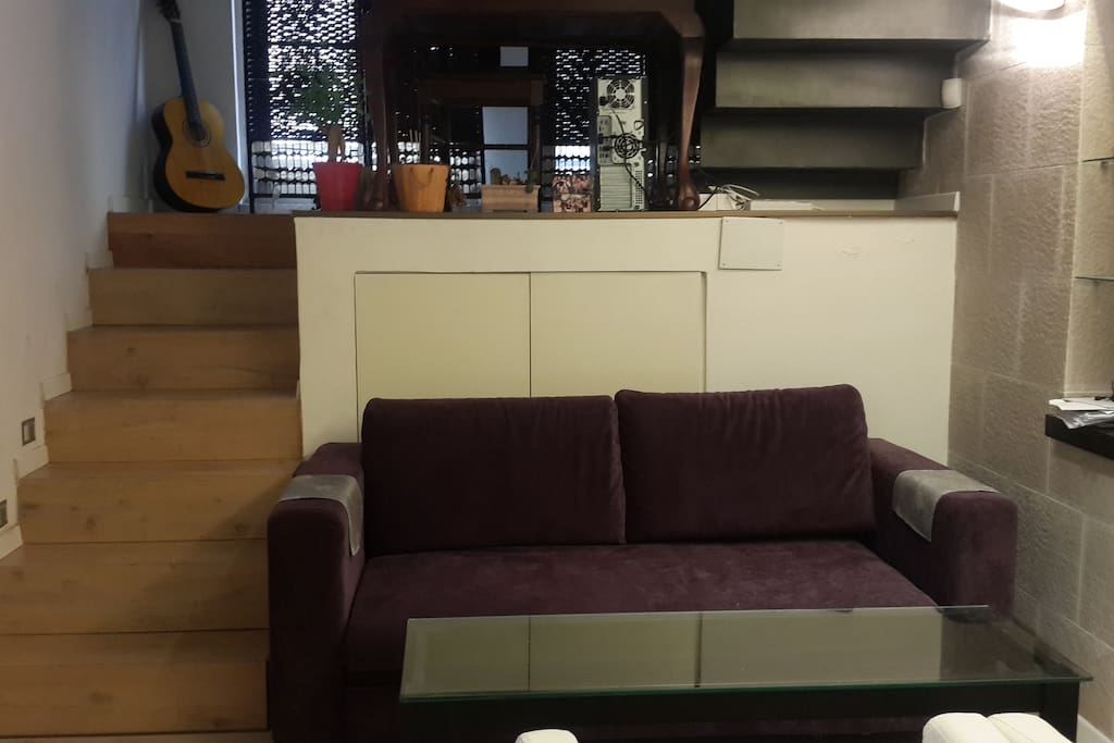 the futon sofa on the floor below can be opened used as an extra bed.