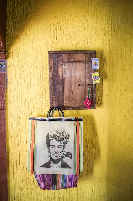 The key and grocery bag hook board next to the front door. Hello Frida.