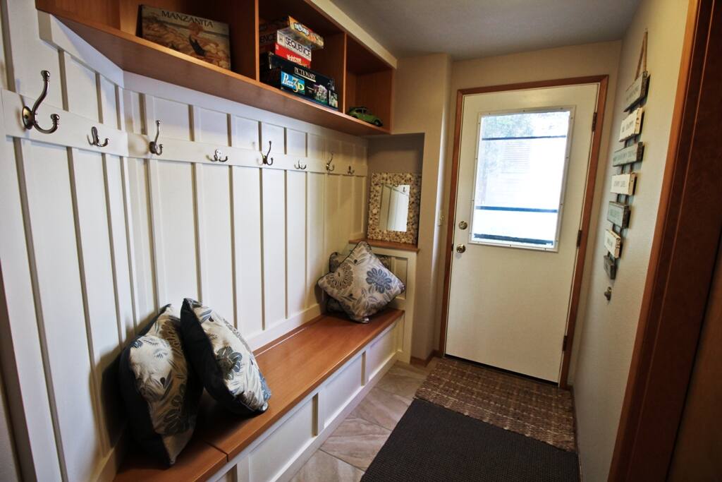 Lower level entry with built-in bench seat and coat hooks.