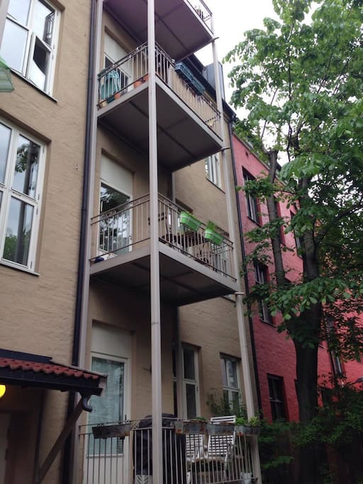 The balcony/apartment seen from the backyard
