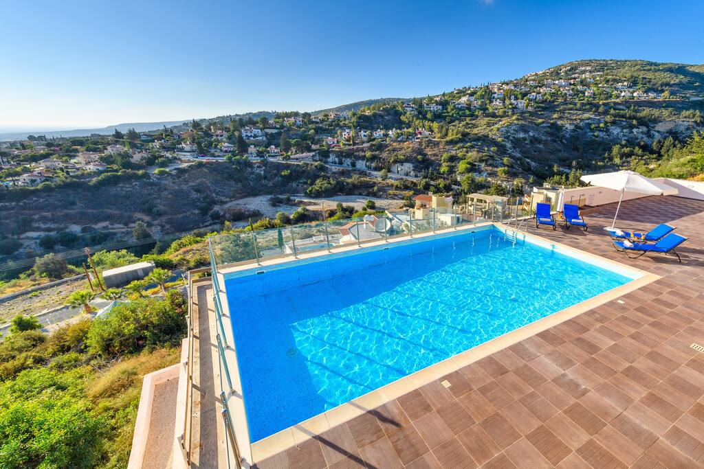 The pool has a vast mountainside backdrop