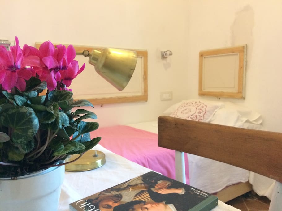 The bedroom is charming in its simplicity.