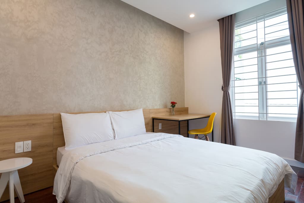 Your room with natural light, queen size bed, working desk, wardrobe, private fridge, private bathroom , clean beddings and towels