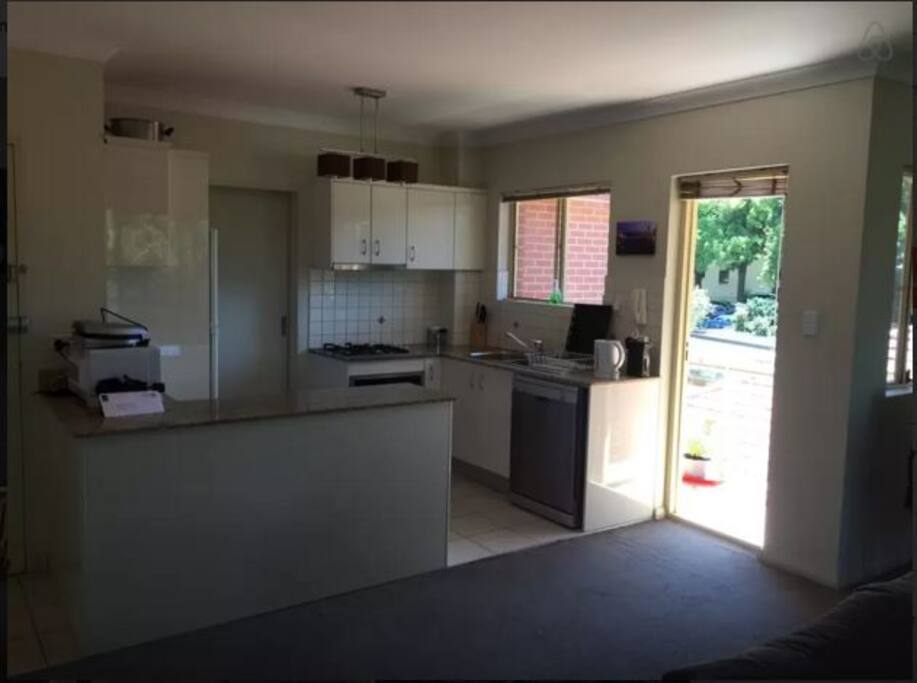 Kitchen leads through to laundry room