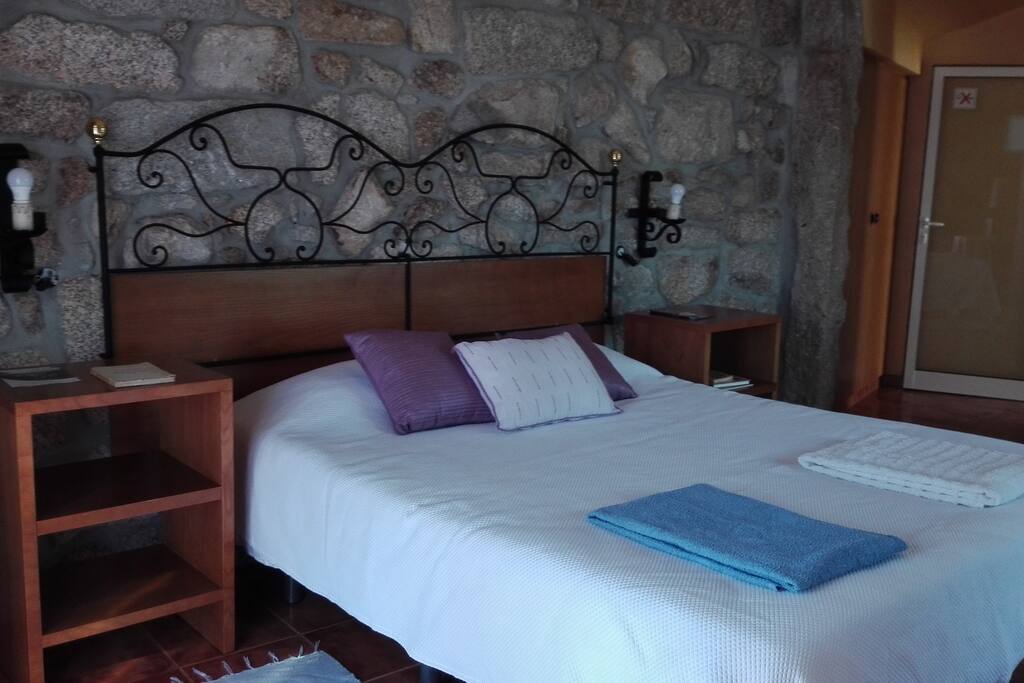 Lilac bedroom with 1 double bed and possibility to add 1 single bed or cot.