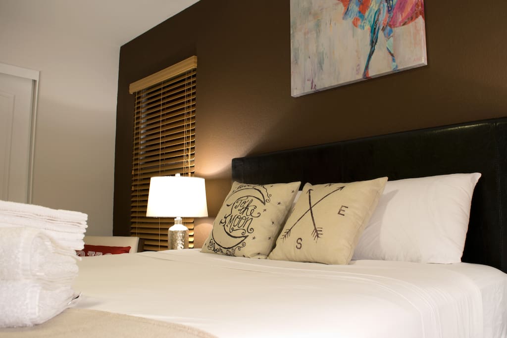 Queen sized beds with stuffed pillows
