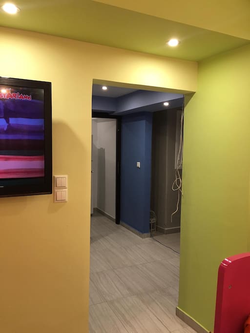 The hall way that takes you to the living room,kitchen,the other bedroom with a queen bed and bathroom with shower .