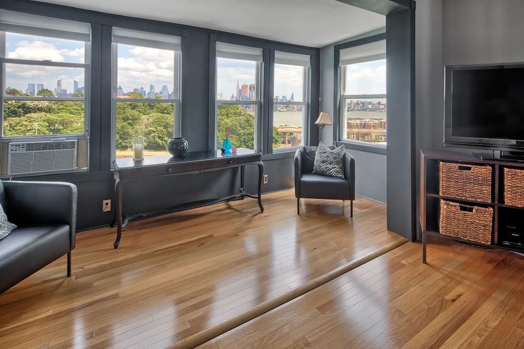 Living room with full views of NYC Skyline