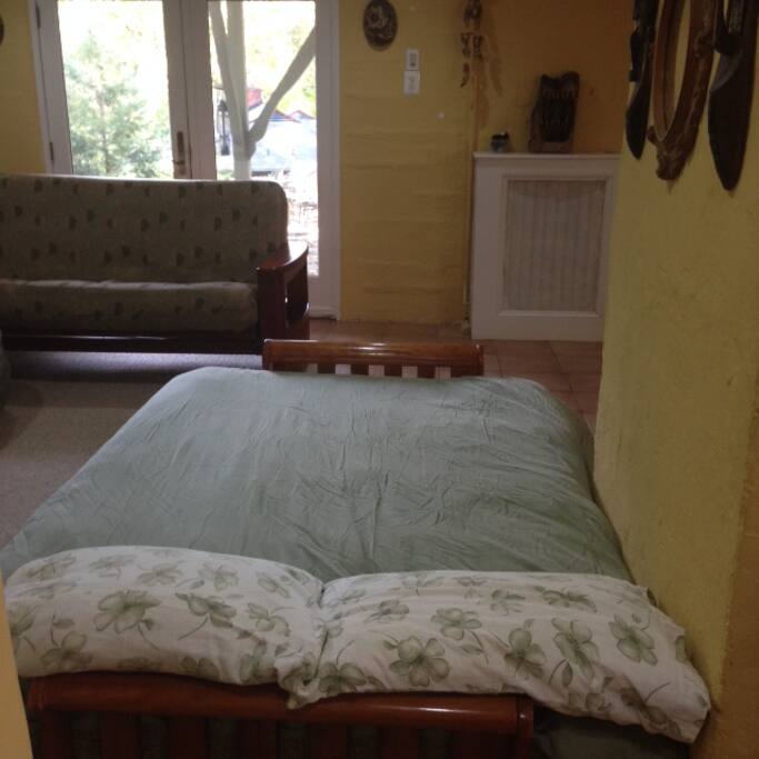 Full size bed with super-comfortable posturepedic mattress in large, open space--keep the shades up for bright light, down for darkness if you want to sleep.