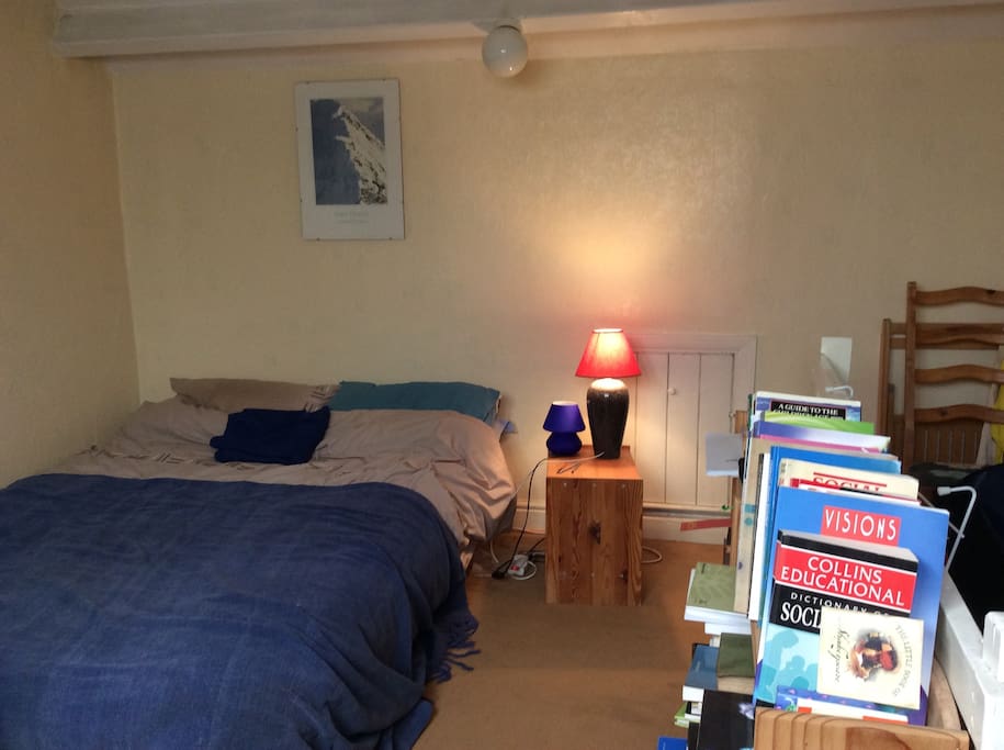 Comfortable basic double bedroom at top of house.