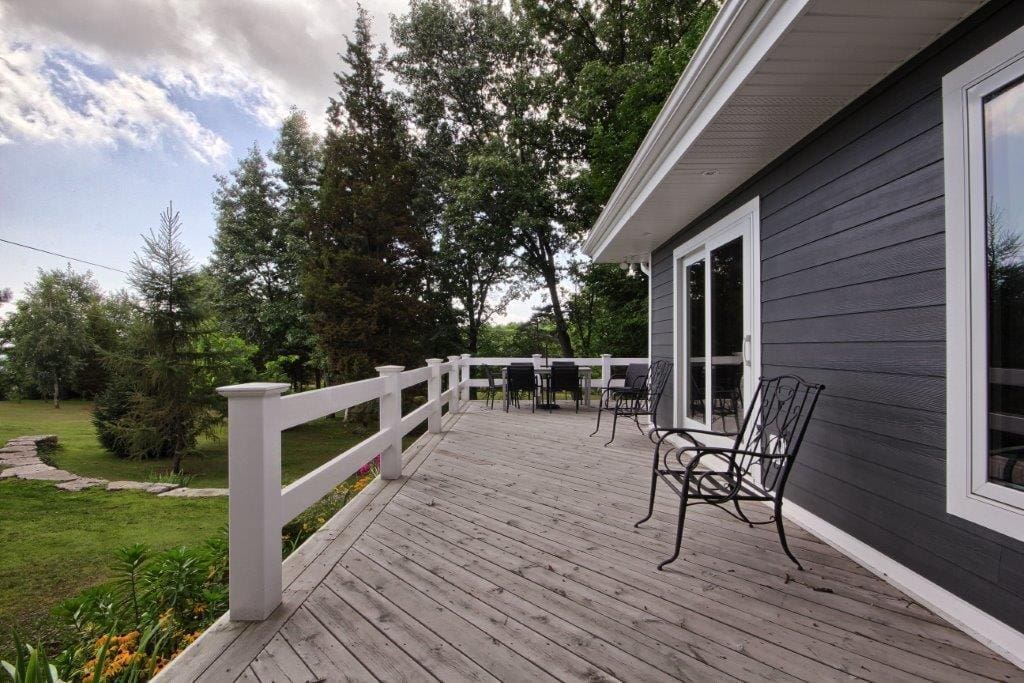 Large wraparound deck to enjoy lake breeze and the sun