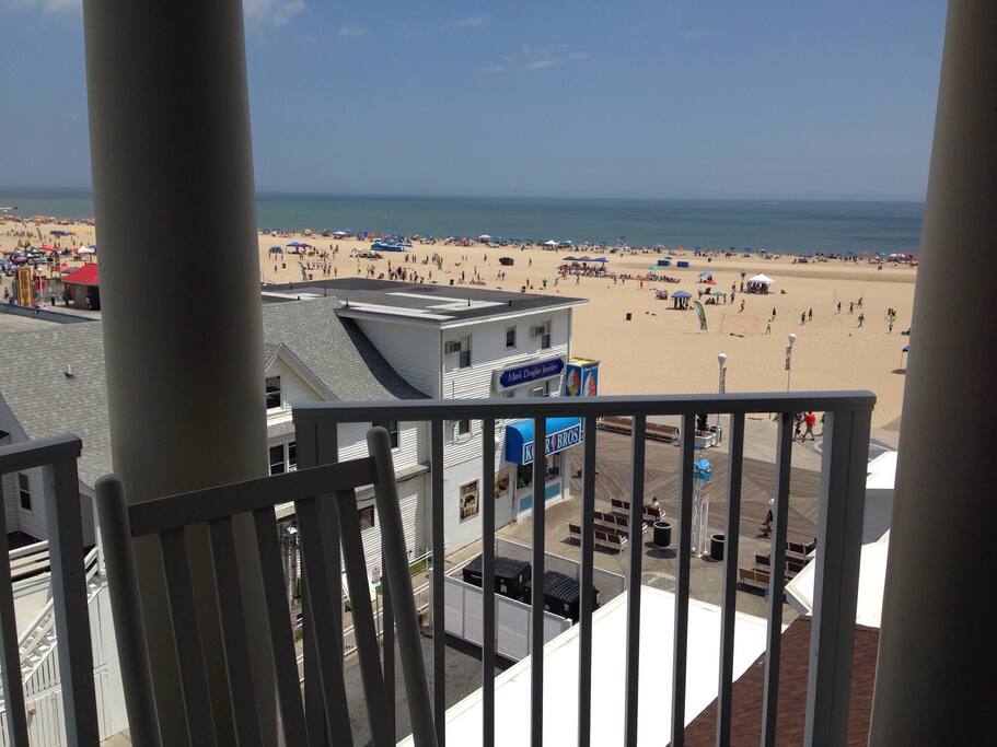 Balcony view of beach and boardwalk.