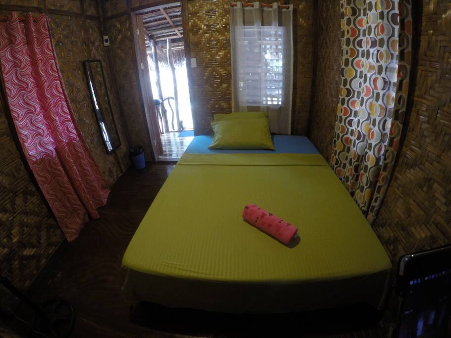 Room with mosquito net and stand van
