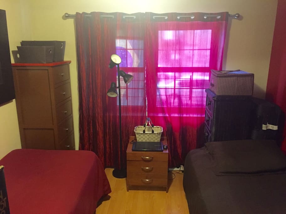 2 beds in a open shared room (With dividers).