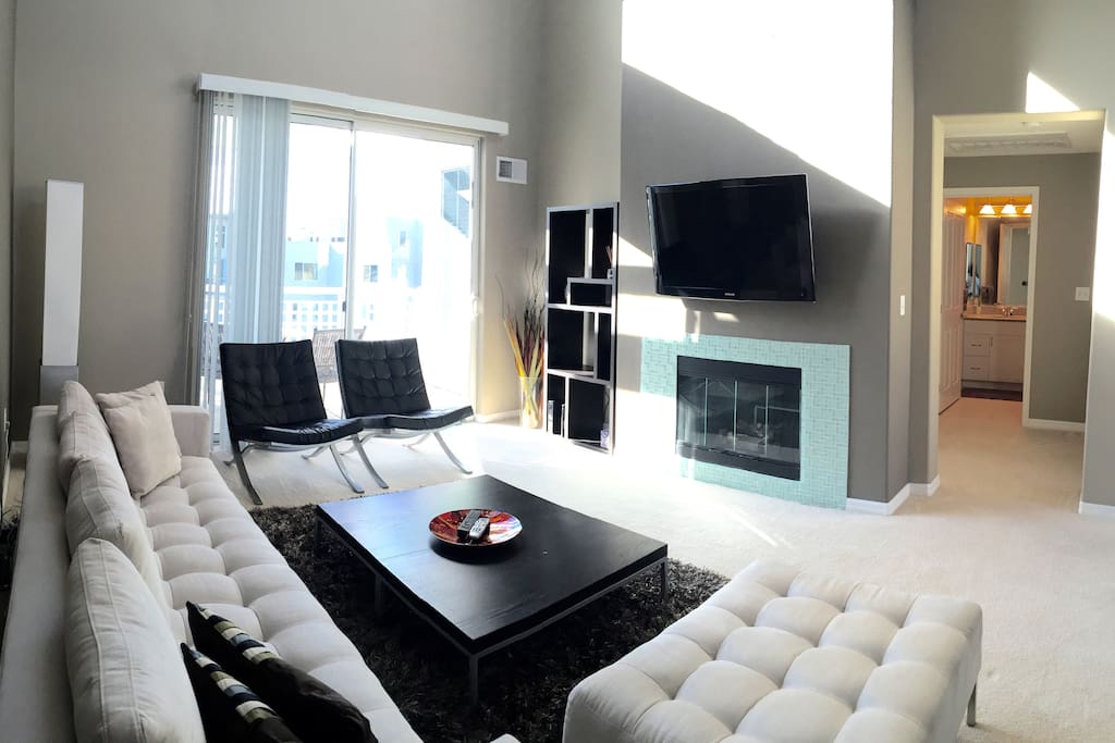 tons of natural light, wall mounted samsung tv, fireplace.