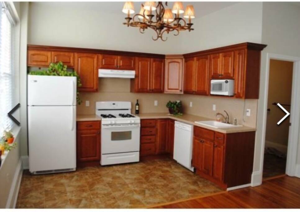 Fully supplied kitchen with dishwasher.