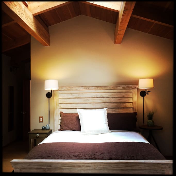 Master suite is truly magical. The bed is a California King with organic saatva matress. Spacious master bath with two person shower. French doors lead to private deck with spa and views of redwoods and canyon.