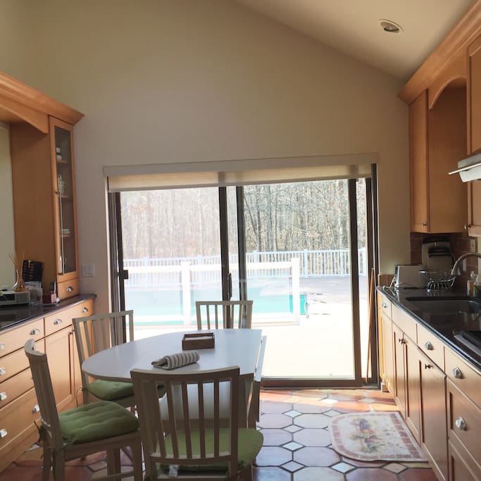 Eat in kitchen with stainless steel appliances and granite counter tops