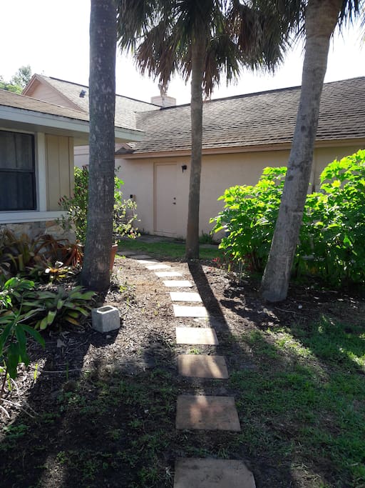 When you park on the right side of the driveway, follow the path to the right of the house